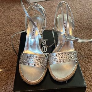Bebe silver wedge lace up sandals.